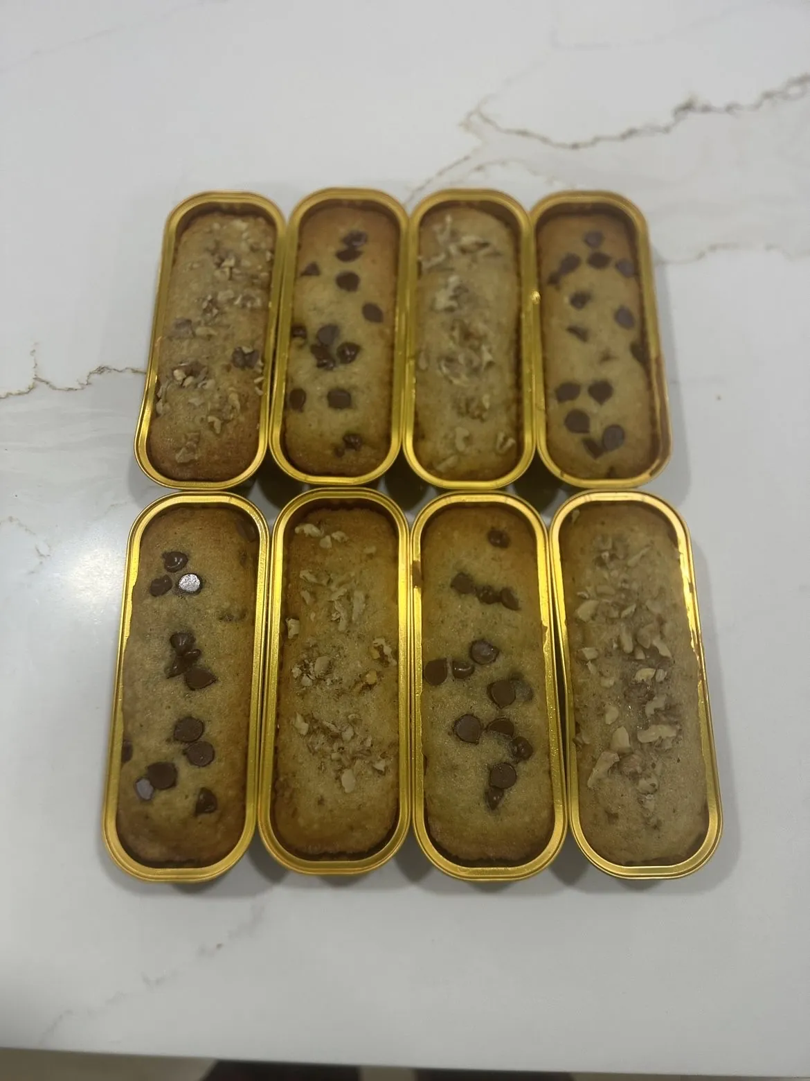 Eight mini banana breads in gold loaf trays, fresh from the oven at Kassey's Kitchen